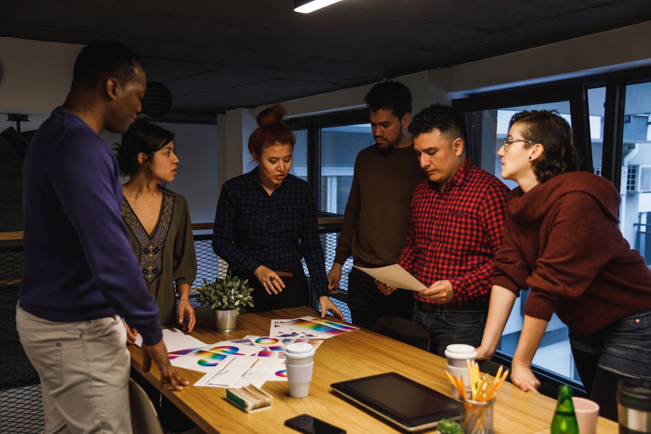 Creative team reviewing brand color palettes and strategy